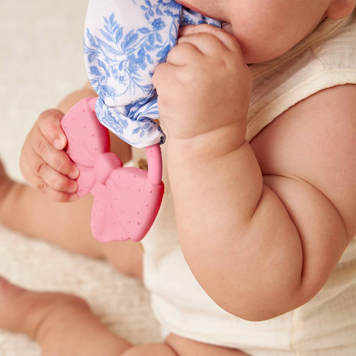 Itzy Ritzy pink silicone bow teether Crinkle Crew™ Bow - Little Birdies Boutique children's store
